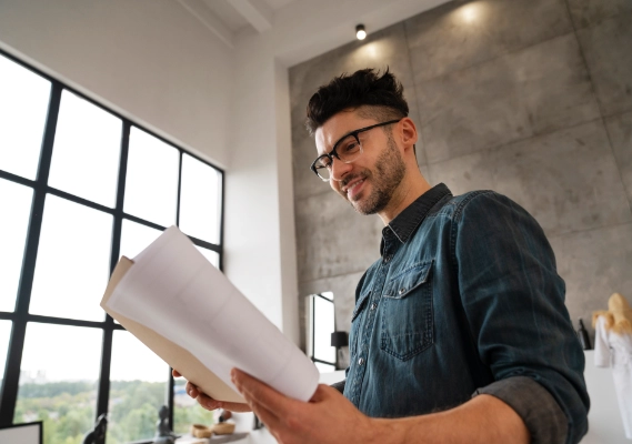 Man reviewing print material